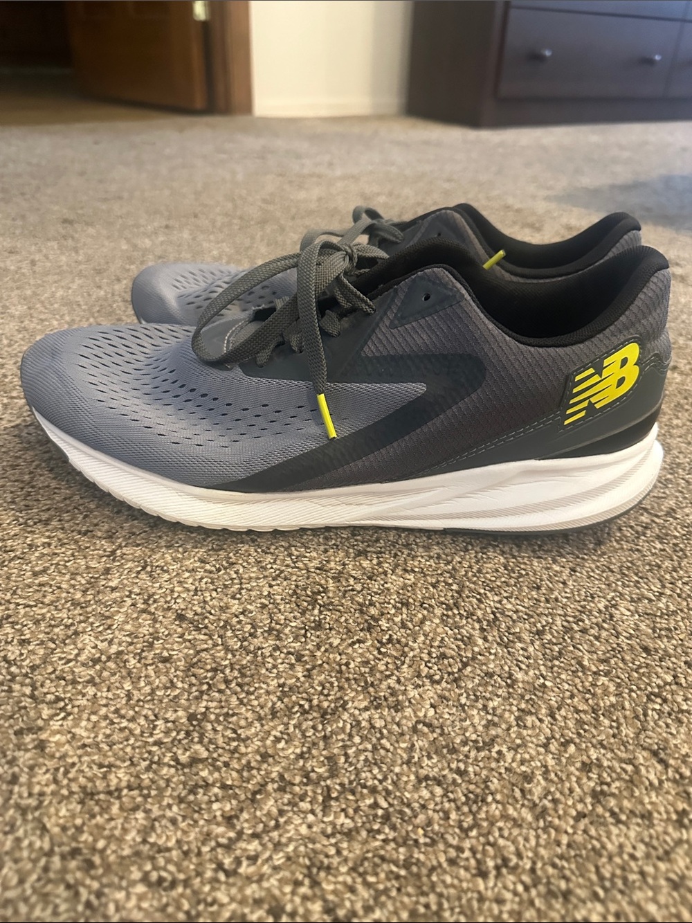 New Balance Grey and Black Running Shoes with Yellow Logo